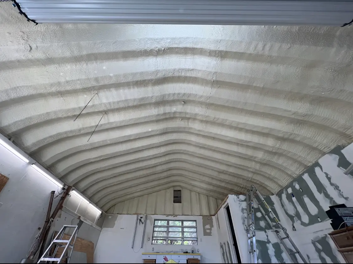 Spray polyurethane foam applied to the underside of a metal roof deck in Memphis